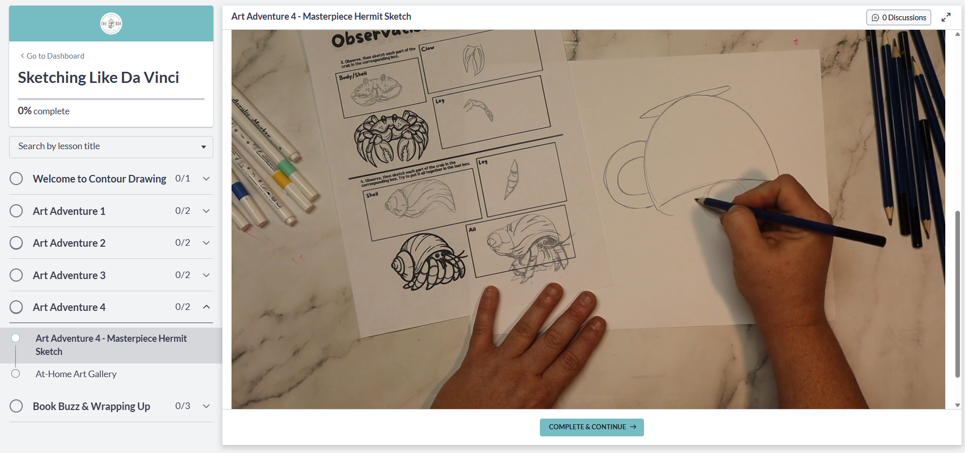 A preview image of the digital art room featuring the artist in residence drawing on a piece of paper with art supplies around, including colored pencils and markers.